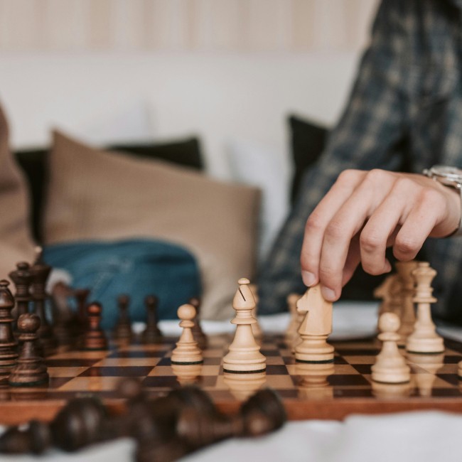 Two persons playing chess together